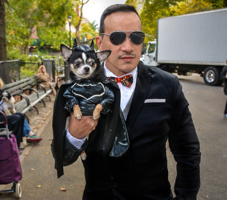 Anthony Rubio with Chihuahua Bogie as Batman at The 25th Annual Tompkins Square Halloween Dog Parade